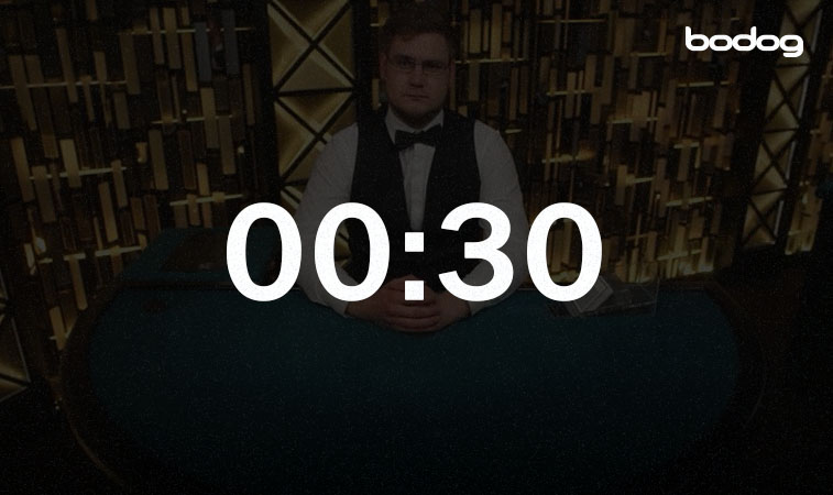 vantagens action clock 1 cronômetro marcando 30 segundos na tela e ao fundo, um dealer esperando